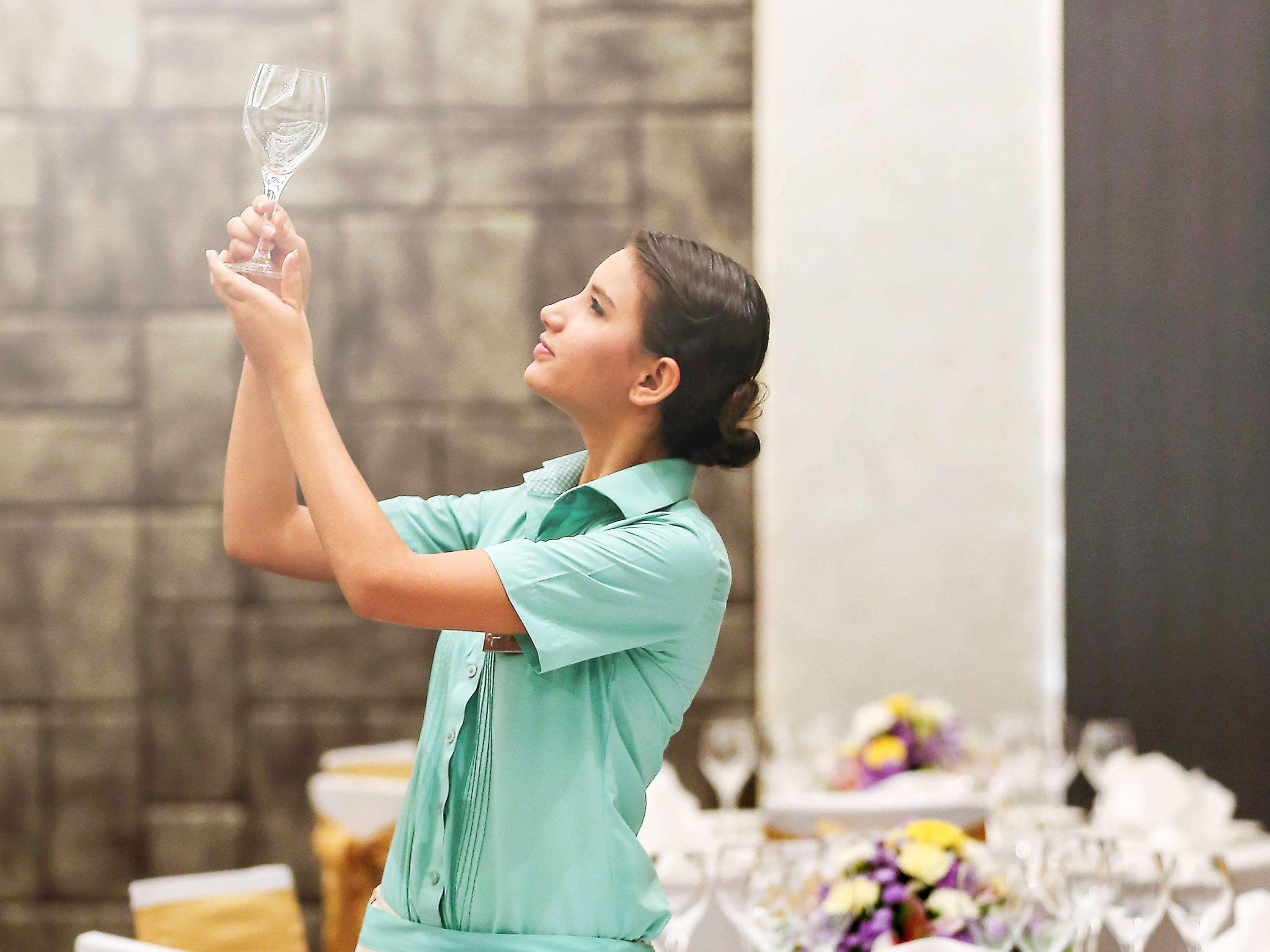 Novotel Goa Candolim Exterior photo A sommelier inspects a wine glass